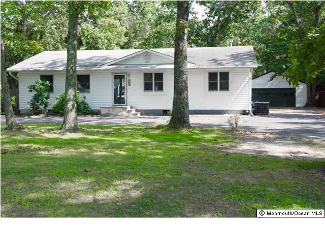 254 Lanes Pond Road Howell, NJ 07731 - Photo 1 of 16 a view of a house with a backyard