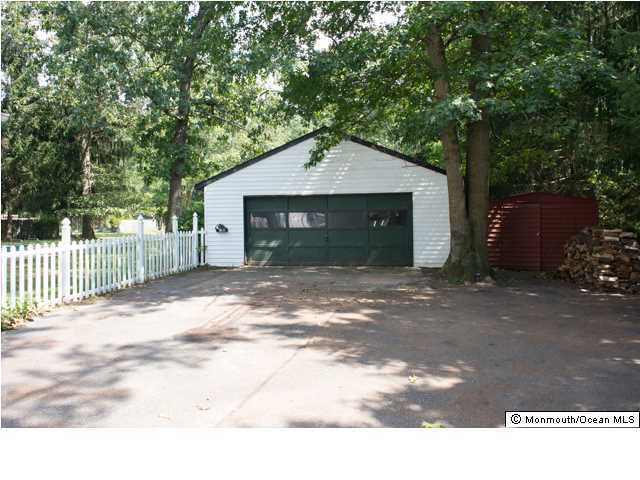254 Lanes Pond Road Howell, NJ 07731 - Photo 2 of 16 a front view of a house with a garage