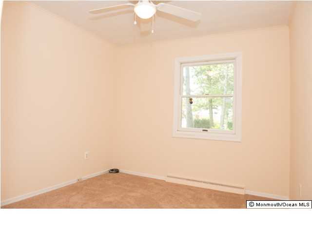 254 Lanes Pond Road Howell, NJ 07731 - Photo 12 of 16 a black and white photo of a living room