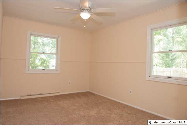 254 Lanes Pond Road Howell, NJ 07731 - Photo 13 of 16 a room with window and ceiling fan