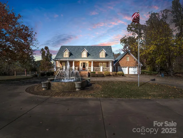 a front view of house with yard green space and yard