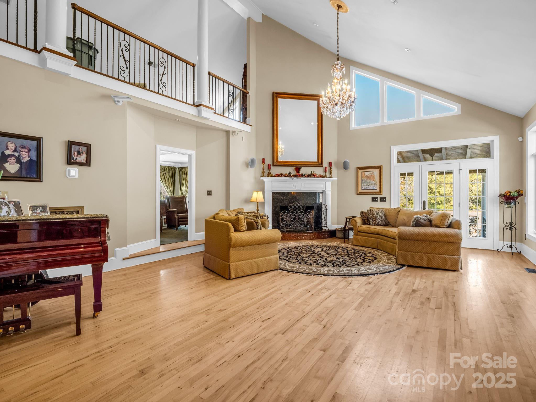 1102 South Mountain Road Bostic, NC 28018 - Photo 15 of 48 a living room with furniture a fireplace and a piano