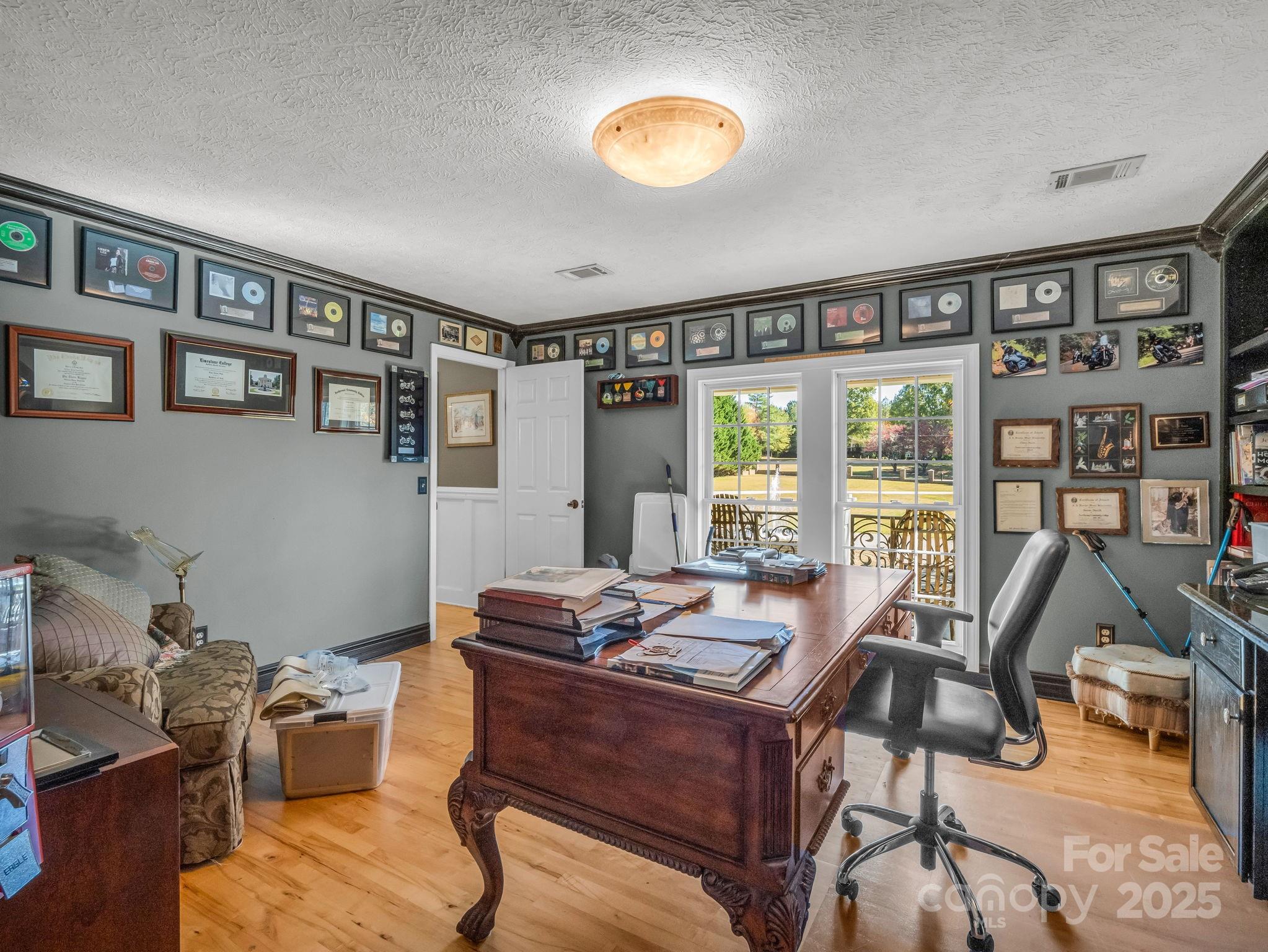 1102 South Mountain Road Bostic, NC 28018 - Photo 24 of 48 a view of a workspace with furniture and a potted plant