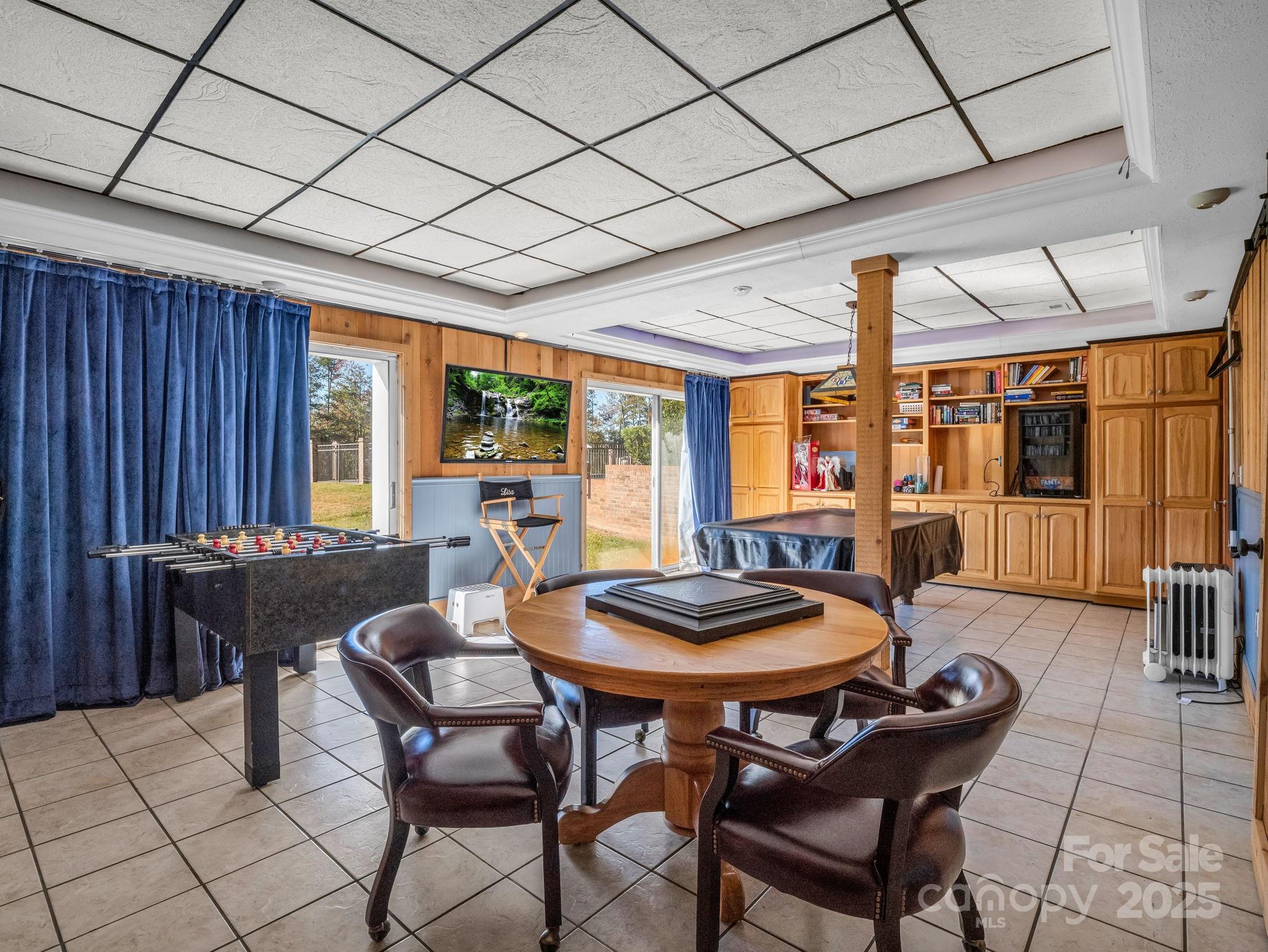 1102 South Mountain Road Bostic, NC 28018 - Photo 27 of 48 a dining room with furniture a chandelier and wooden floor