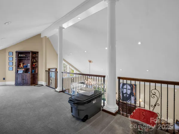 a bedroom with a bed and a ceiling fan