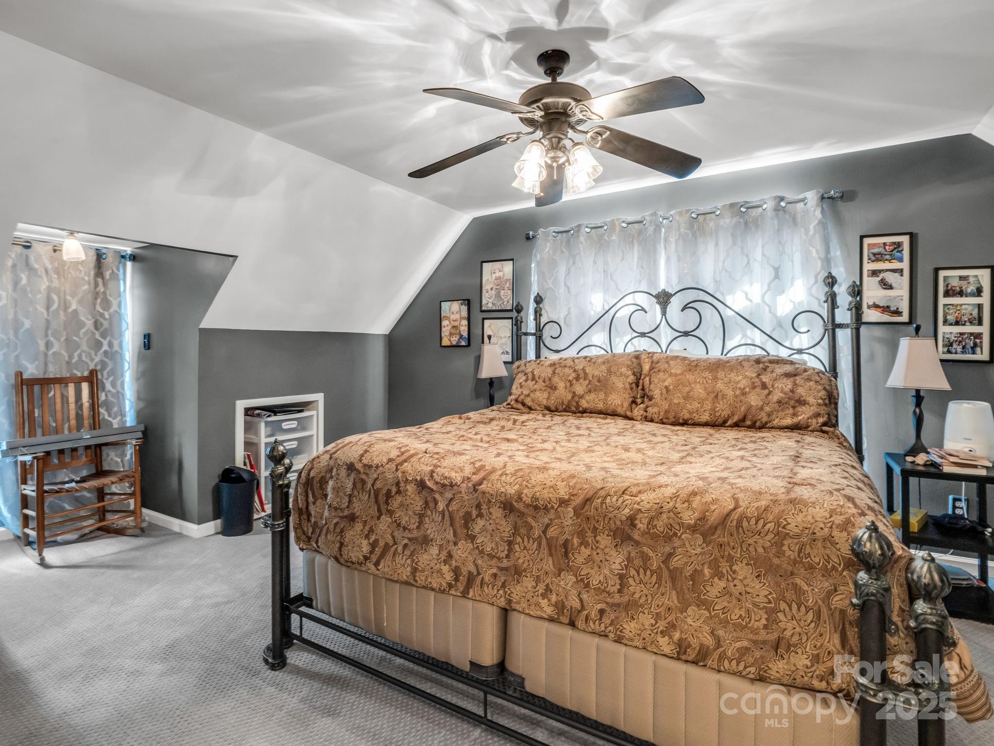 1102 South Mountain Road Bostic, NC 28018 - Photo 30 of 48 a bedroom with a bed and a ceiling fan