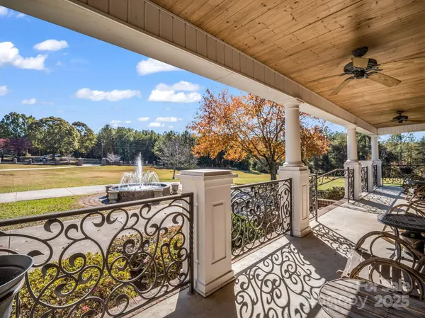 a view of a patio with wooden floor and outdoor seating