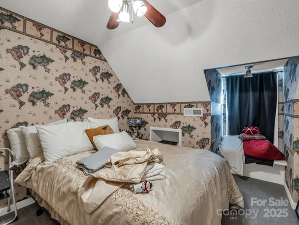 a patio with glass top table and chairs