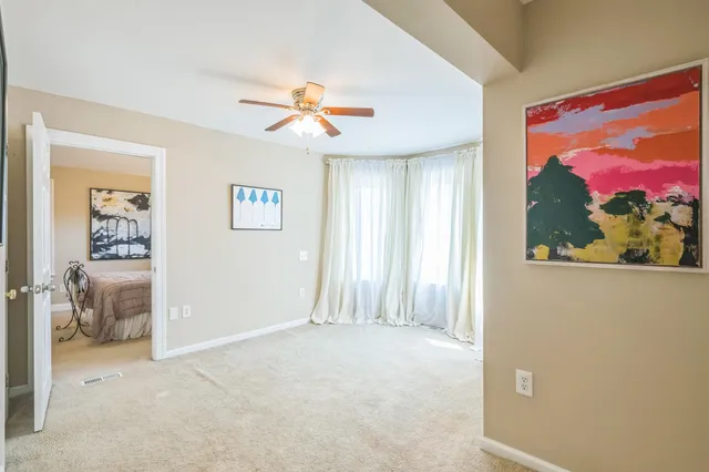 a view of a house with a tree and plants