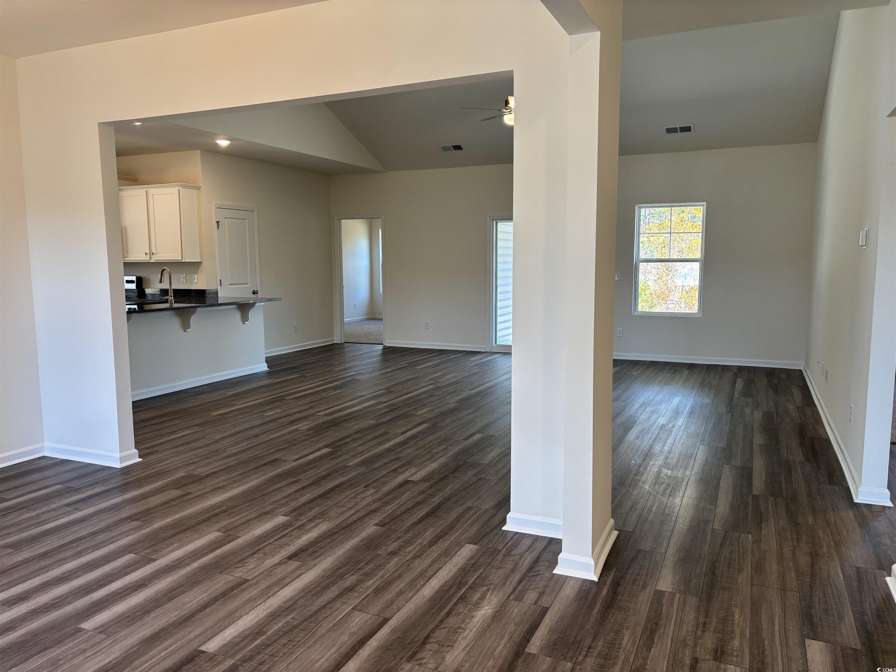 216 Palmetto Sand Loop Conway, SC 29527 - Photo 8 of 38 Unfurnished living room with a chandelier, lofted