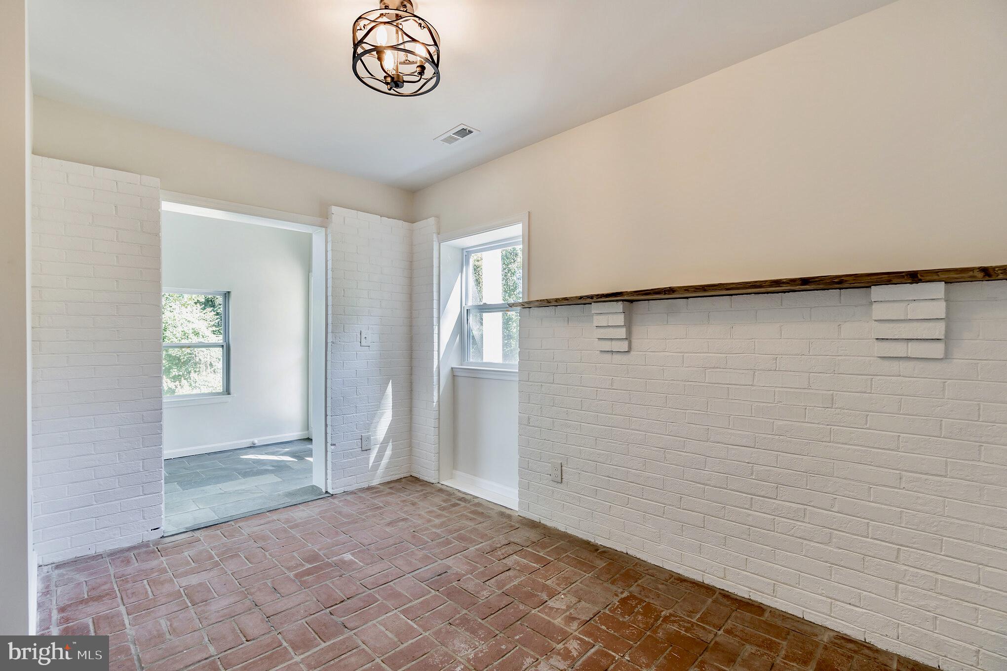 3222 Beaver Dam Road Chesapeake Beach, MD 20732 - Photo 8 of 41 Rustic Dining Space With 50's Brick Throughout