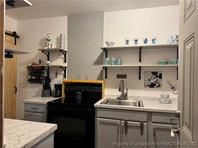 a view of kitchen island with appliances