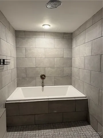 a view of a storage and utility room with washer and dryer