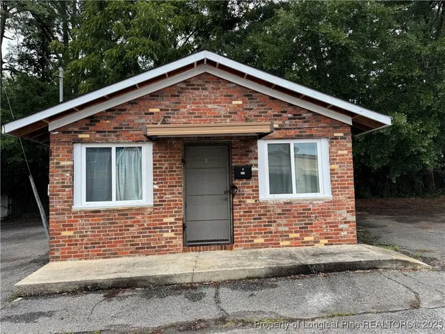a front view of a house with garage