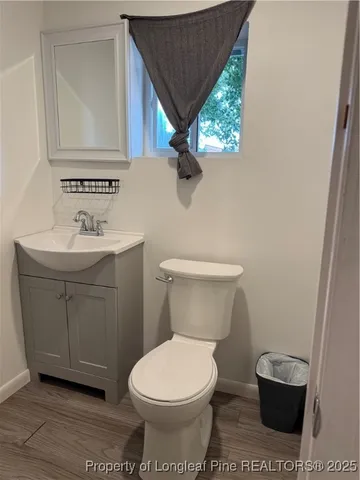 a living room with furniture window and flat screen tv