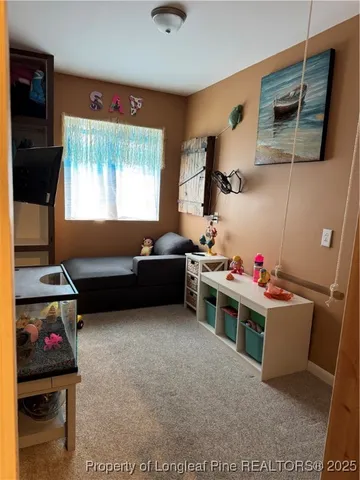 a view of room with furniture and ceiling fan