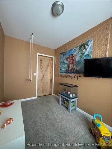 a view of a storage and utility room with washer and dryer