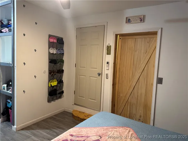 a bedroom with a bed and a view of bedroom