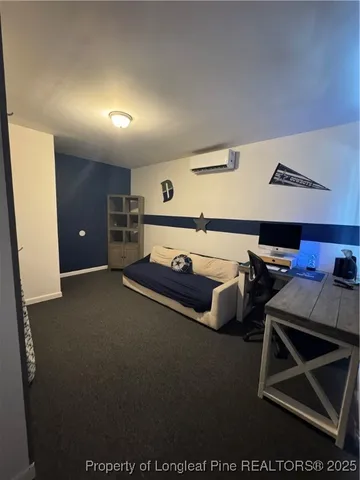 a bedroom with furniture and window