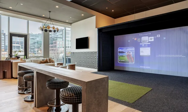 a kitchen with a sink a counter top space a large window and furniture
