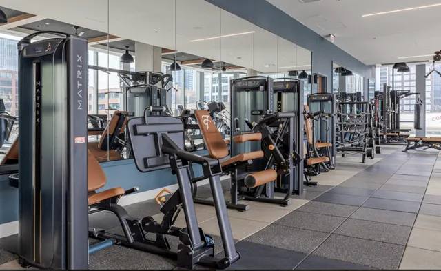 a lobby with furniture and floor to ceiling window