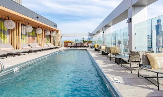 a view of swimming pool with outdoor seating