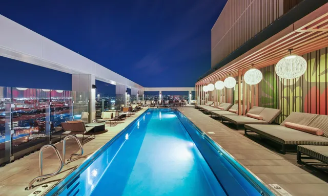 a view of a dining room with furniture and a chandelier