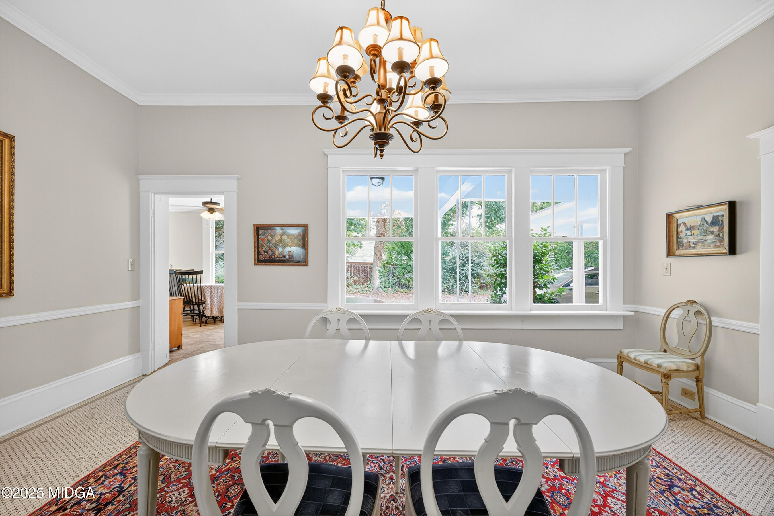 3341 Ridge Avenue Macon, GA 31204 - Photo 19 of 46 a dining room with furniture a rug and a chandelier