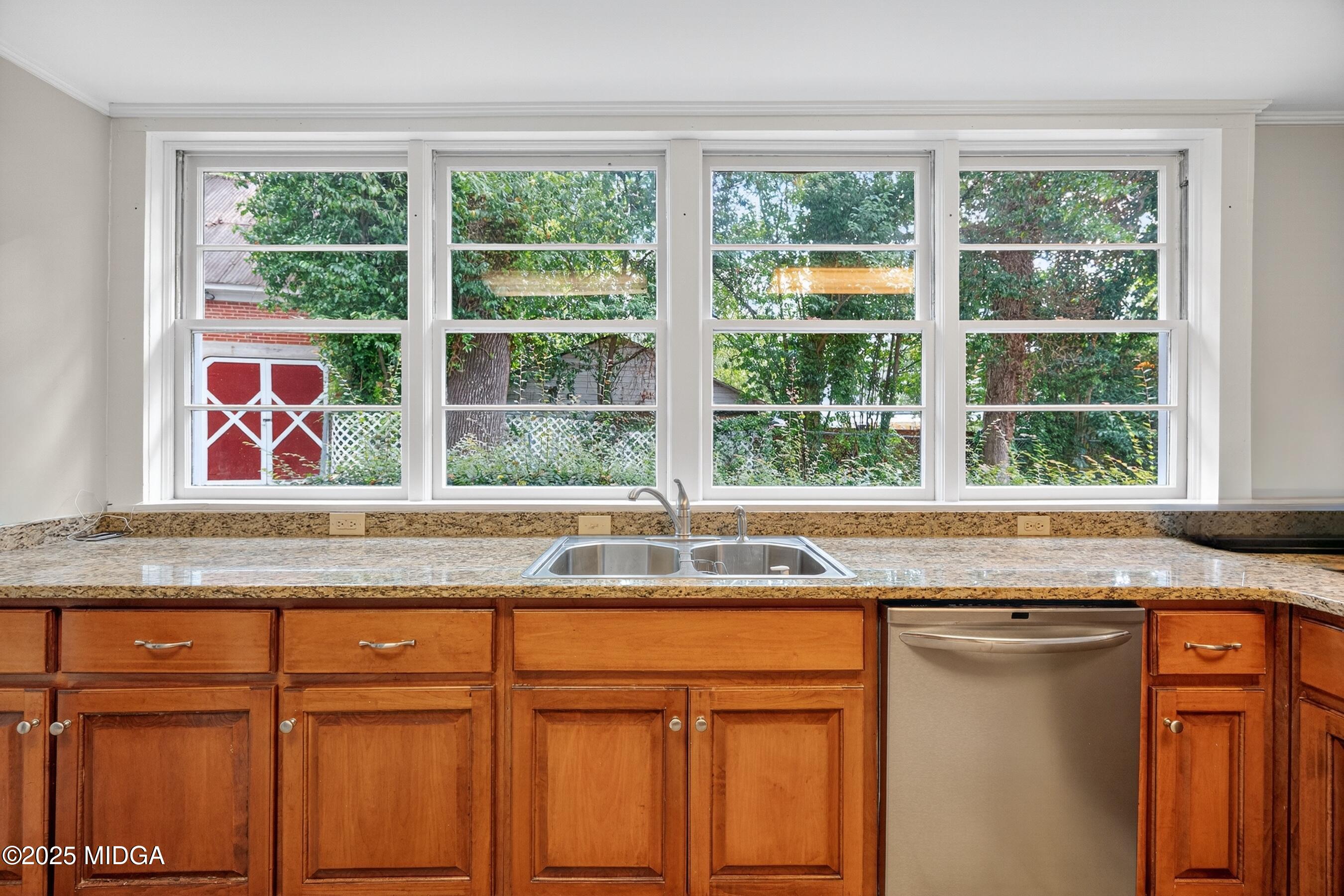 3341 Ridge Avenue Macon, GA 31204 - Photo 22 of 46 a kitchen with granite countertop cabinets and window
