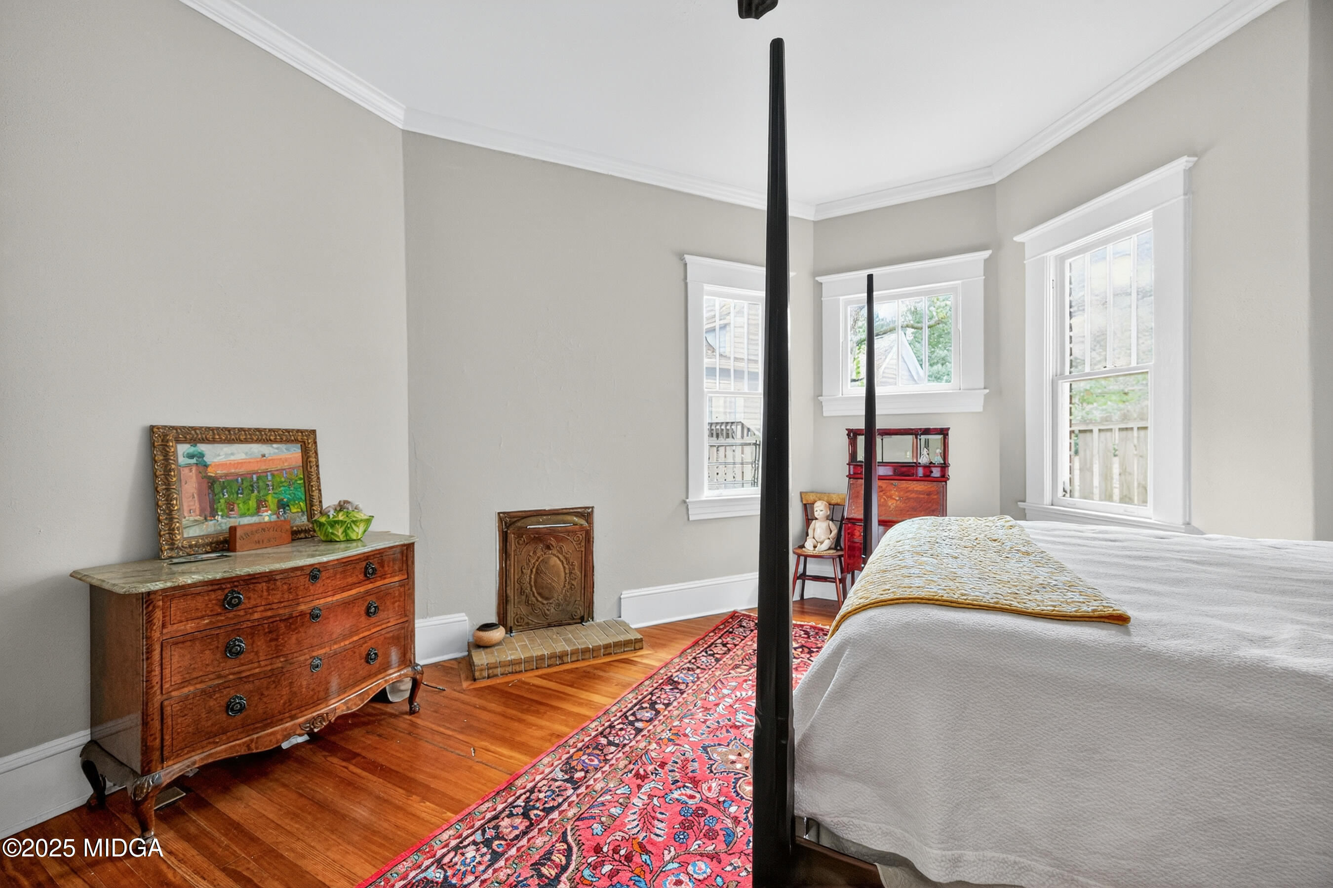 3341 Ridge Avenue Macon, GA 31204 - Photo 26 of 46 a bedroom with a bed and a dresser next to a window