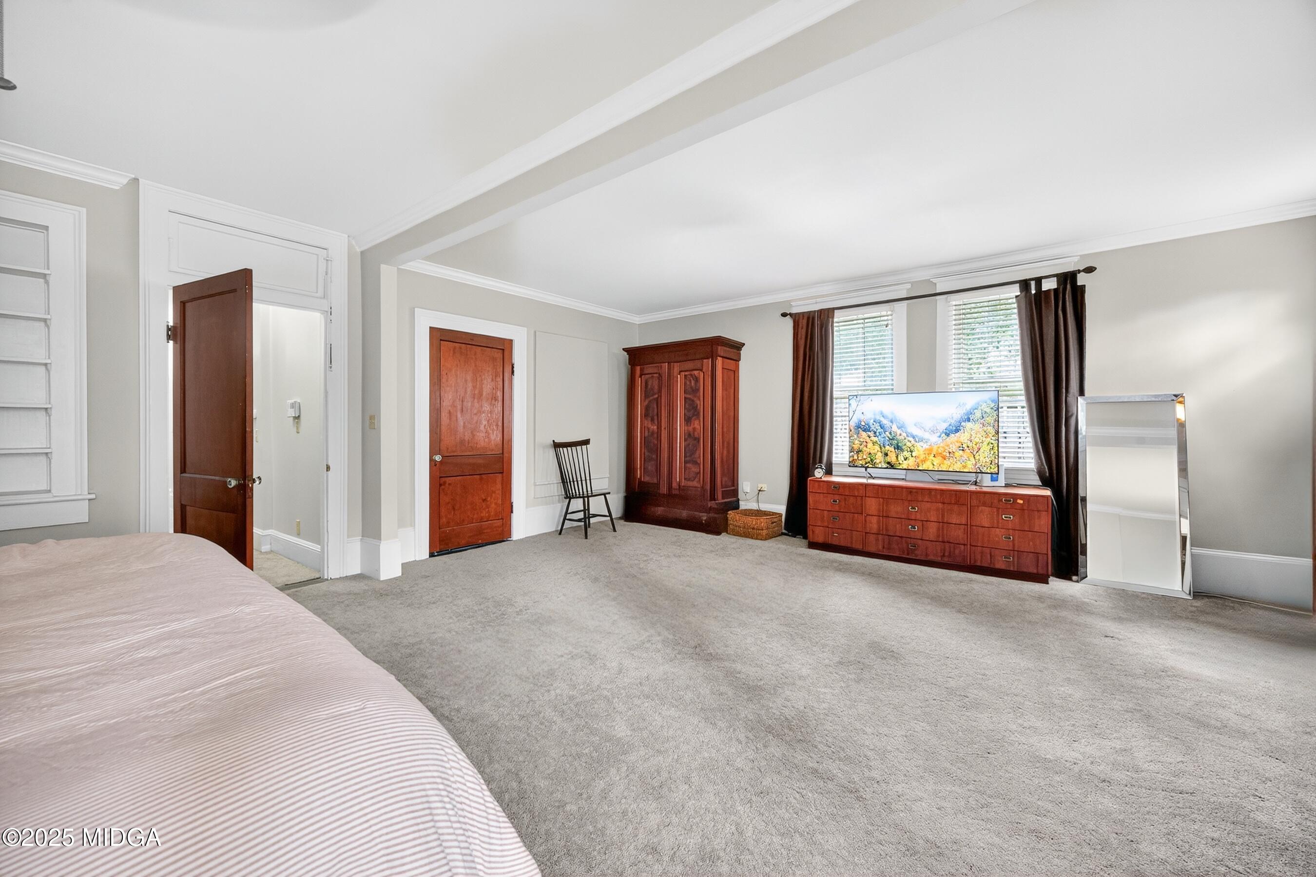 3341 Ridge Avenue Macon, GA 31204 - Photo 29 of 46 a spacious bedroom with a bed and a window