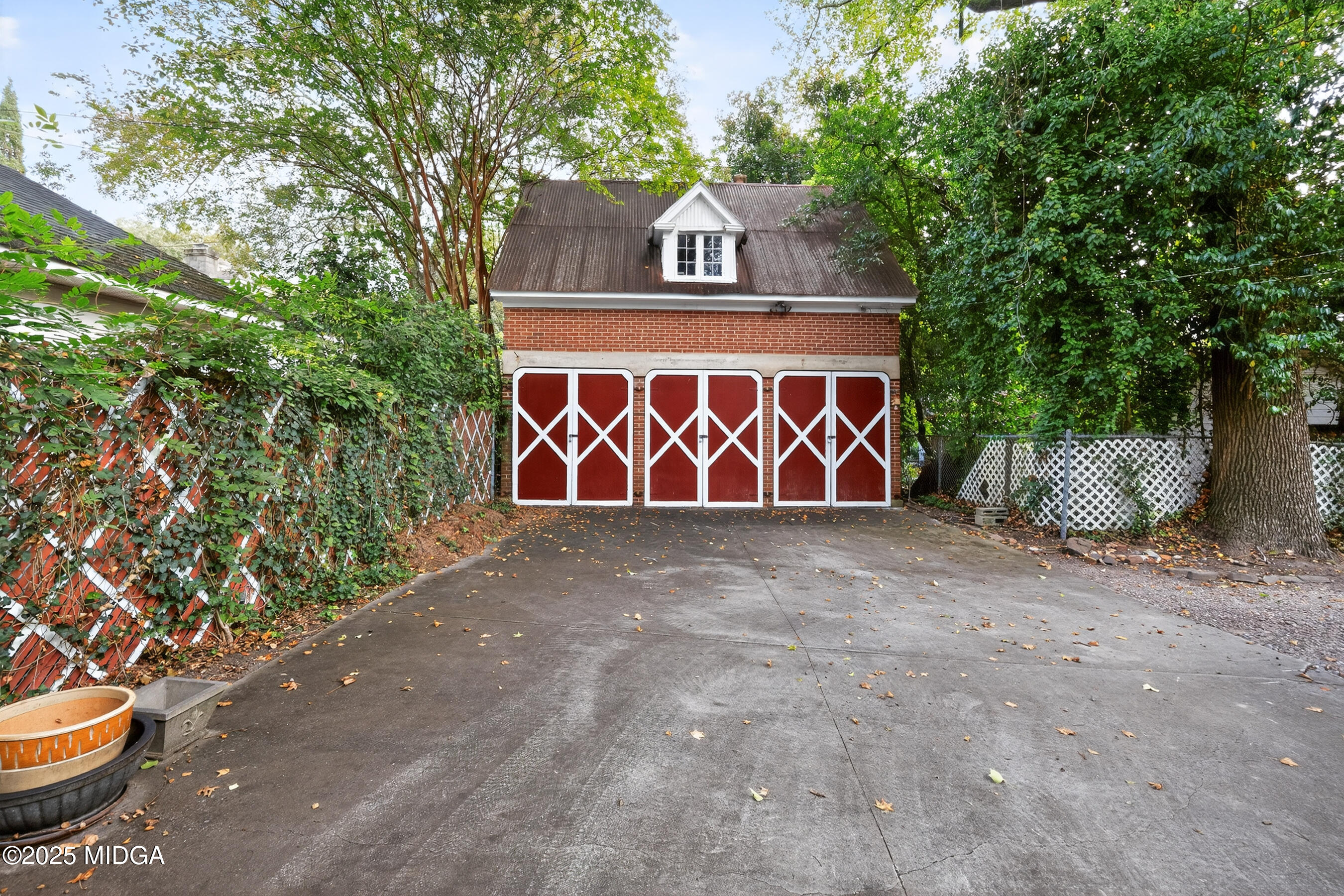 3341 Ridge Avenue Macon, GA 31204 - Photo 3 of 46 a front view of a house with a yard and garage