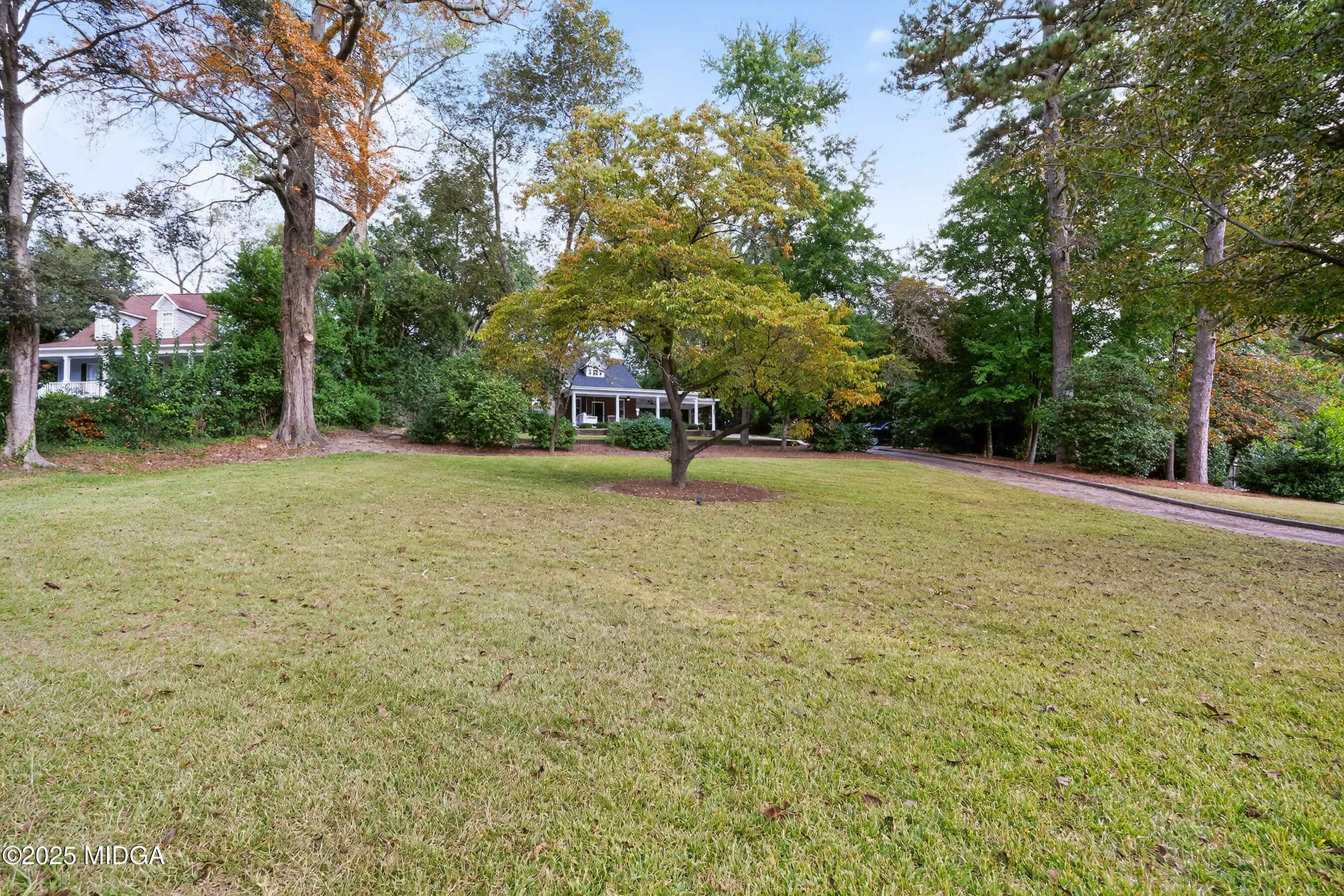 3341 Ridge Avenue Macon, GA 31204 - Photo 7 of 46 a swimming pool with trees in the background