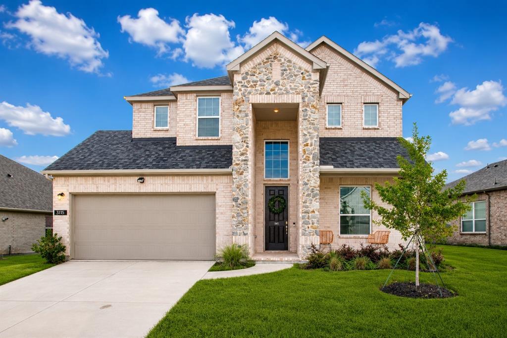 3115 Giovanni Point Princeton, TX 75407 - Photo 2 of 26 Two-story brick and stone facade residence featuring an attached two-car garage, dark asphalt shingle roof, and a prominent stone entryway