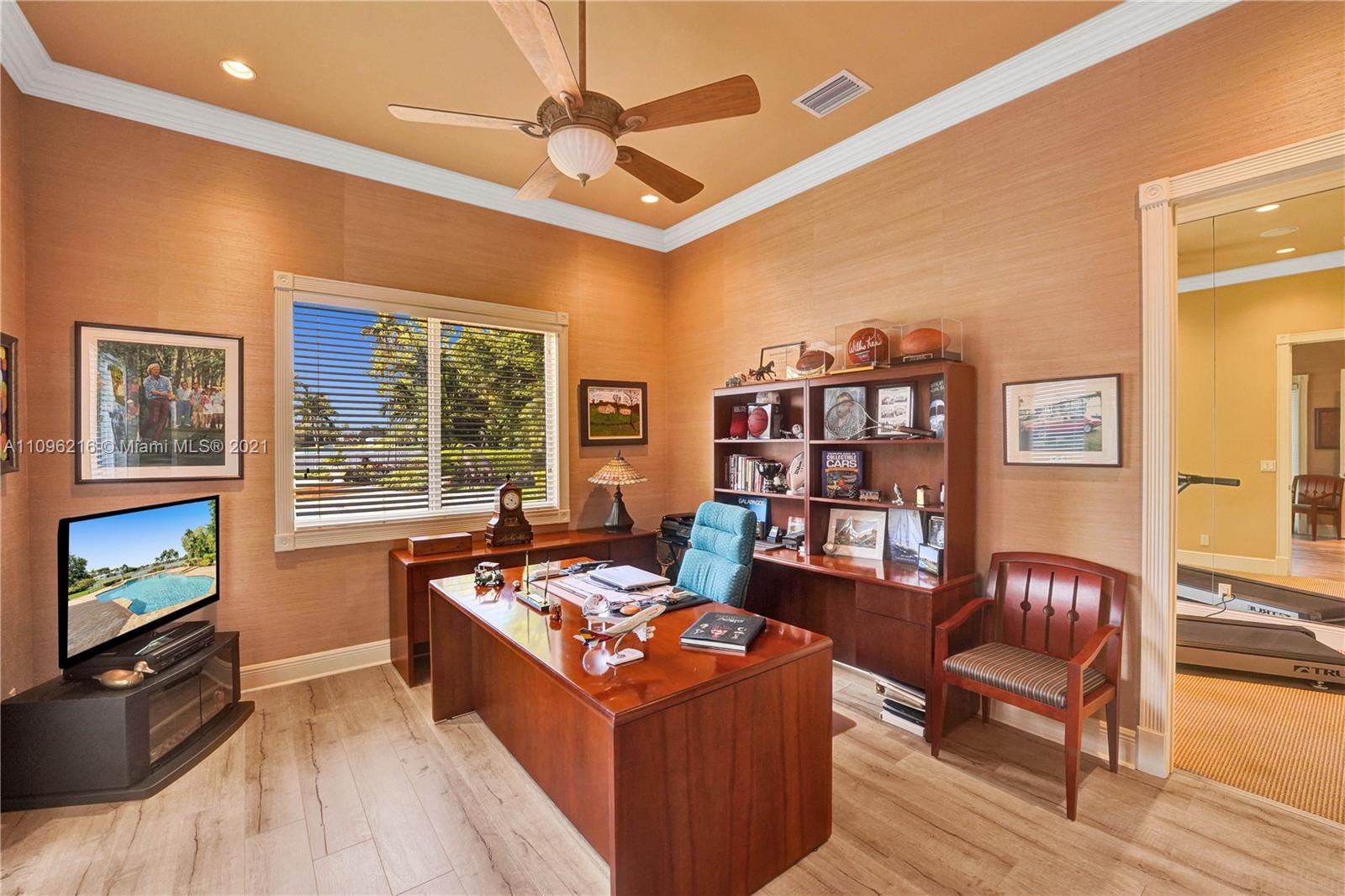 2755 Paddock Road Weston, FL 33331 - Photo 12 of 51 a living room with furniture flat screen tv and a fireplace