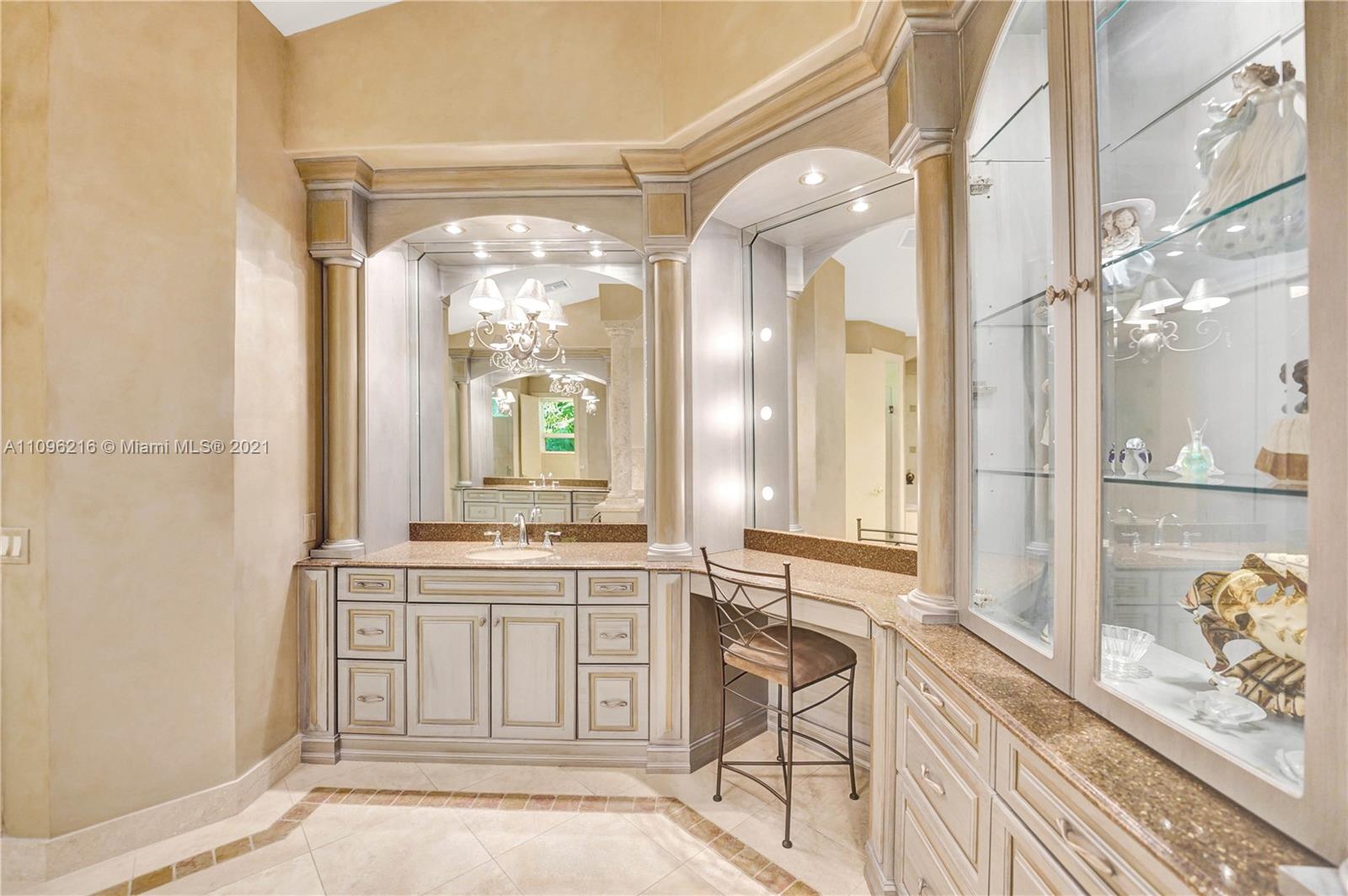 2755 Paddock Road Weston, FL 33331 - Photo 16 of 51 a spacious bathroom with a granite countertop sink mirror and a bathtub