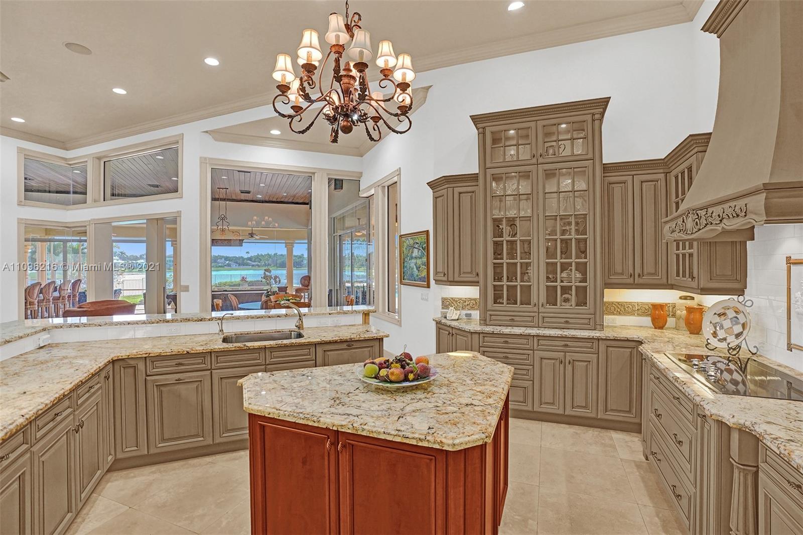 2755 Paddock Road Weston, FL 33331 - Photo 19 of 51 a kitchen with stainless steel appliances granite countertop a sink a stove and a refrigerator