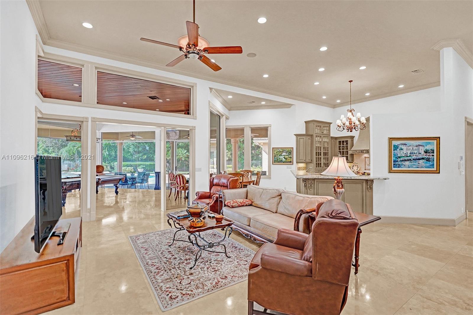 2755 Paddock Road Weston, FL 33331 - Photo 23 of 51 a living room with furniture and a large window