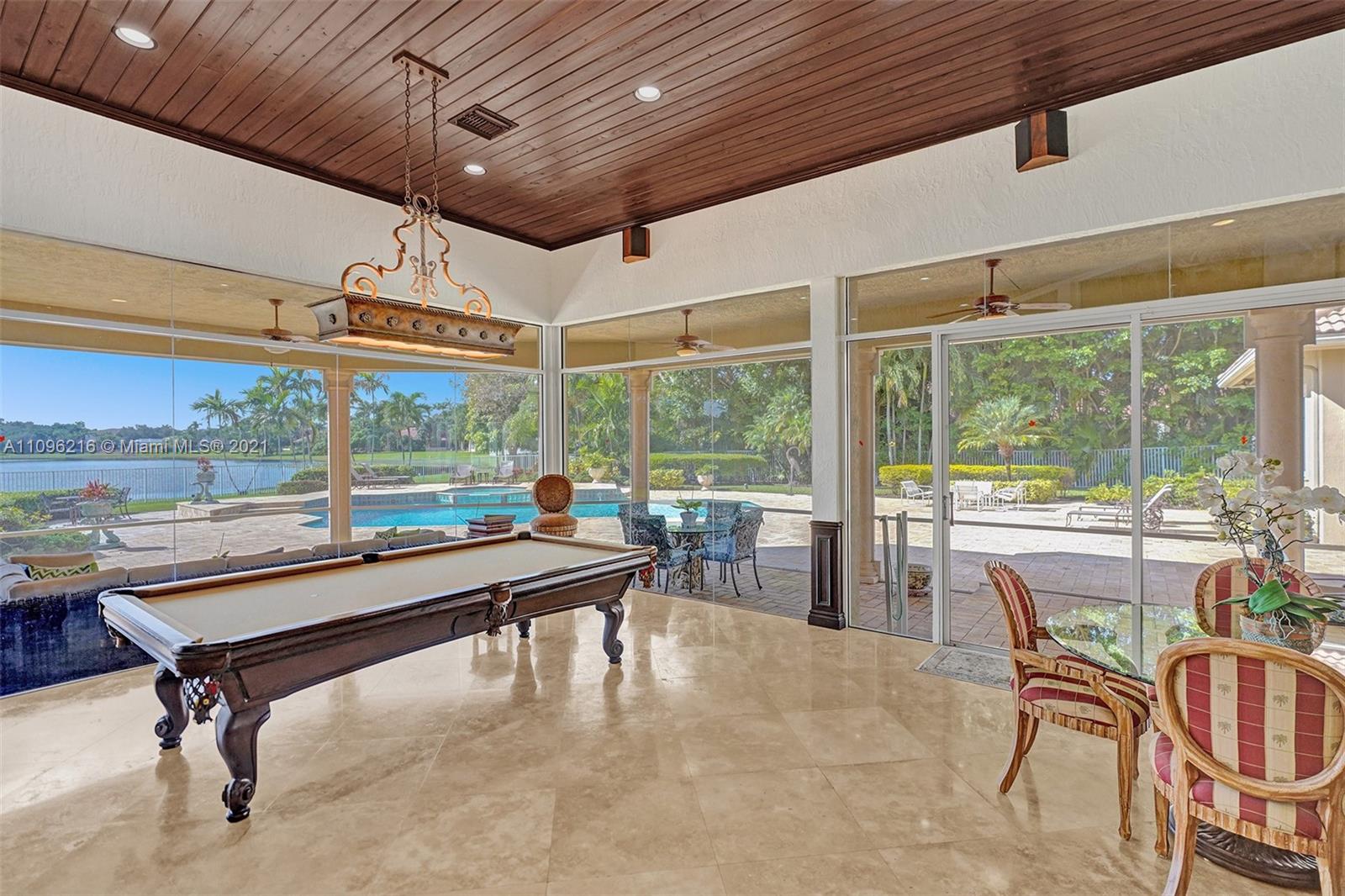 2755 Paddock Road Weston, FL 33331 - Photo 24 of 51 a view of a tables and chairs in patio