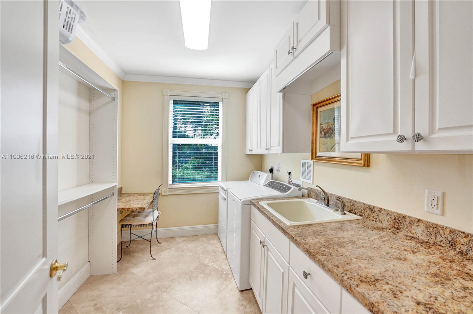 2755 Paddock Road Weston, FL 33331 - Photo 28 of 51 a kitchen with granite countertop a sink and a stove