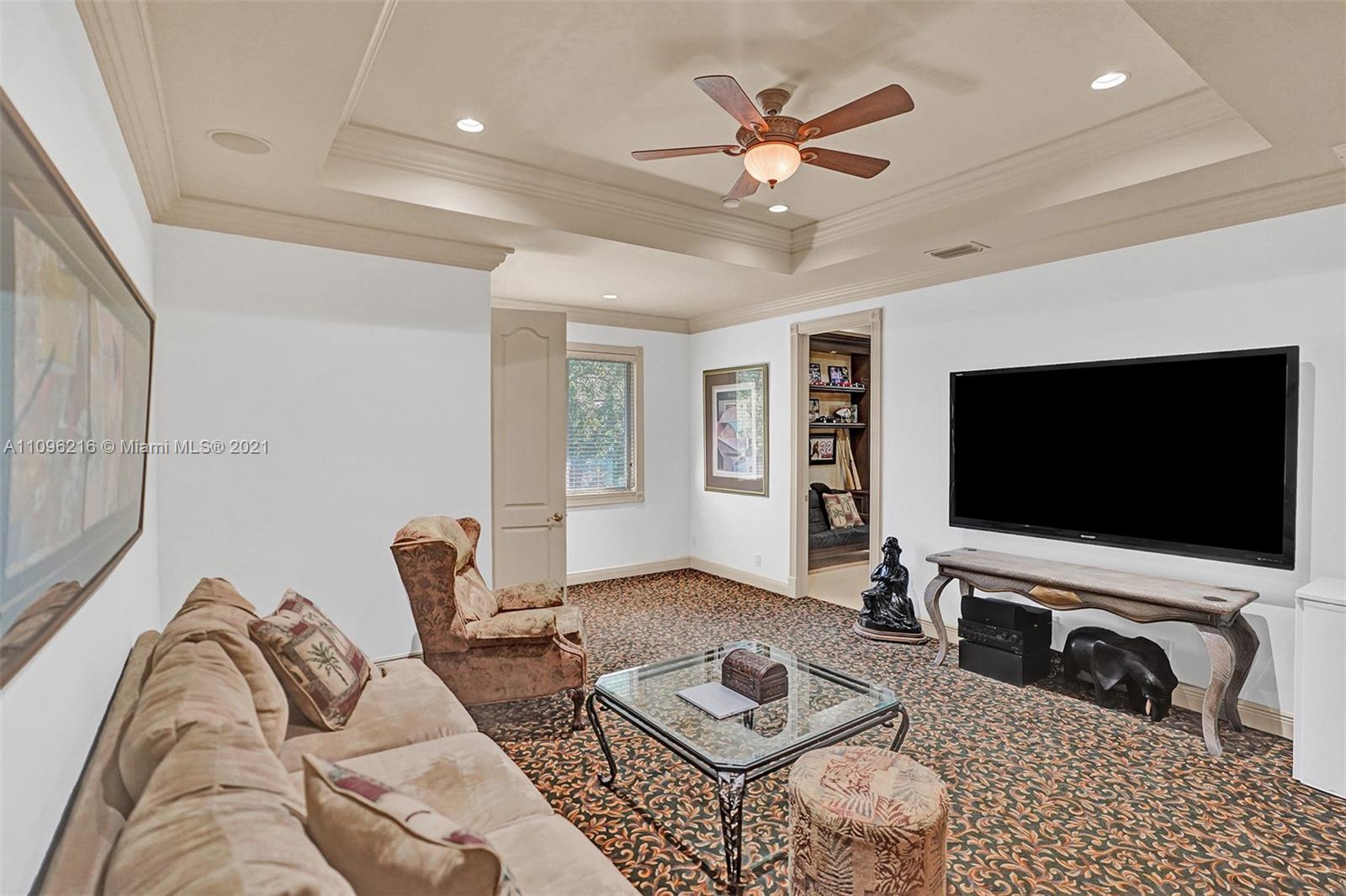 2755 Paddock Road Weston, FL 33331 - Photo 33 of 51 a living room with furniture and a flat screen tv