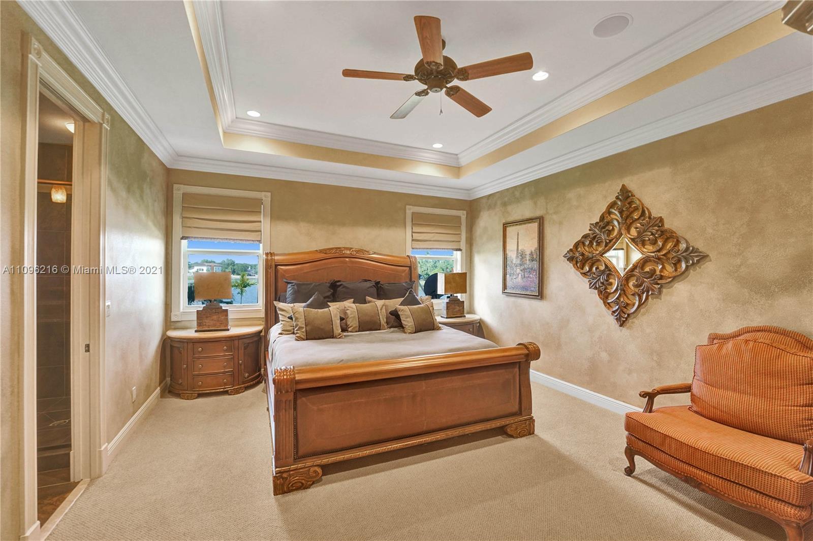 2755 Paddock Road Weston, FL 33331 - Photo 36 of 51 a bedroom with furniture and a large window