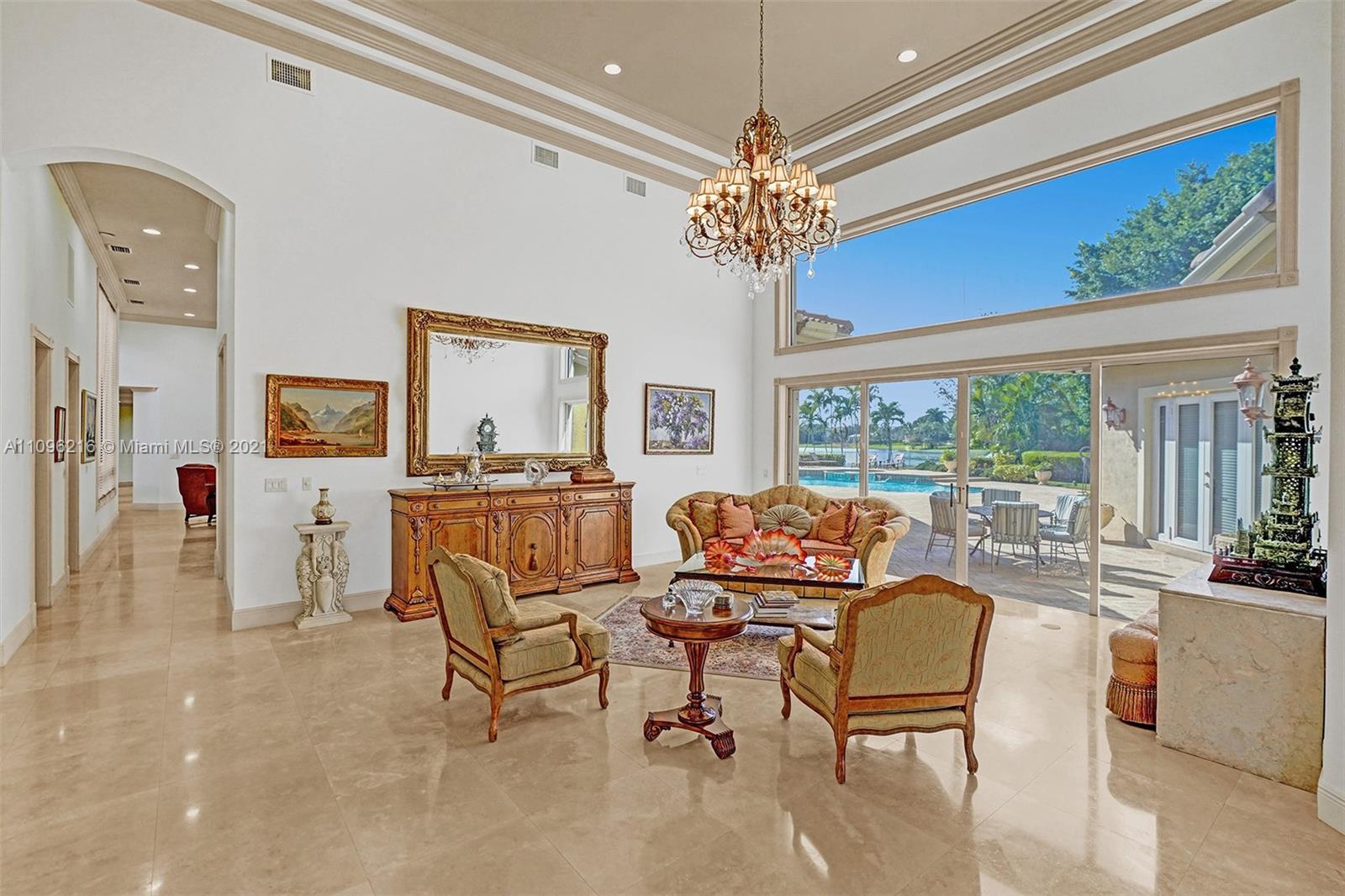 2755 Paddock Road Weston, FL 33331 - Photo 5 of 51 a view of a livingroom with furniture a chandelier and window