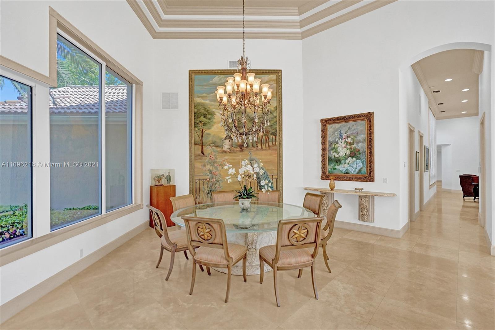 2755 Paddock Road Weston, FL 33331 - Photo 7 of 51 a dining room with furniture a chandelier and window