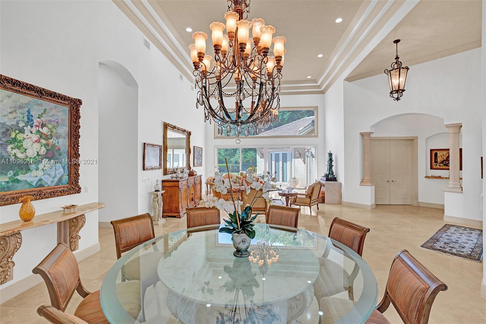 2755 Paddock Road Weston, FL 33331 - Photo 8 of 51 a living room with fireplace furniture and a chandelier