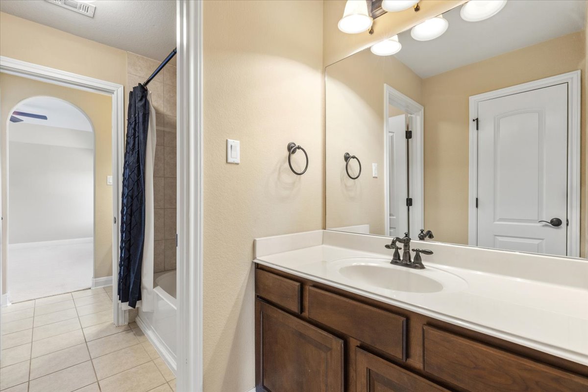111 Whitley Drive Austin, TX 78738 - Photo 30 of 38 Jack and jill bathroom upstairs, between beds 2-3. Shower/tub combo.