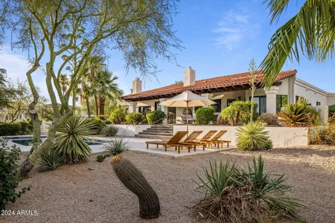 a view of a swimming pool with a patio