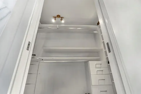 a view of an empty walk in closet
