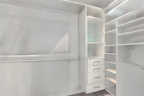 a view of a hallway with a white walls