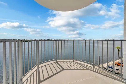 a view of a balcony with chairs